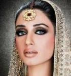 Beautiful woman with lavish jewelry and embroidered head covering Beautiful woman with lavish jewelry and embroidered head covering