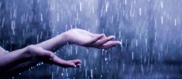God is One. Hands catching rain