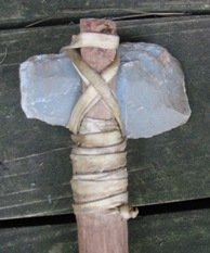 Ancient technology: roughly made stone, wood and leather axe