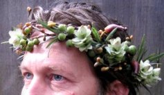 Bible weddings: Man with a garland of flowers in his hair