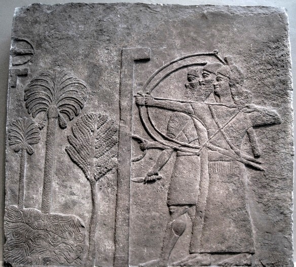 The defenders of the city (see upper left-hand corner) had small light bows used for sniper fire. The archers shooting from below the walls, easy targets for the city's defenders, were shielded by mobile wicker walls. Note the rounded shield-grip similar to the later Greek shield illustrated below.
